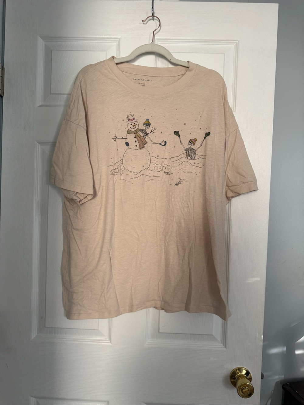 Cozy Cream Skeleton Snowman Graphic Tee